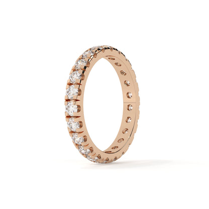 Rose gold ring with diamonds on a white background
