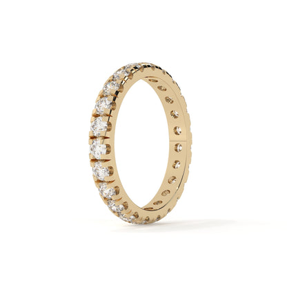 Gold ring with diamonds on a white background