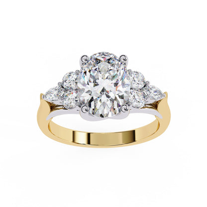 Gold ring with a large diamond and smaller diamonds on a white background