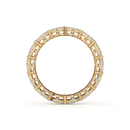 Gold ring with a geometric design on a white background