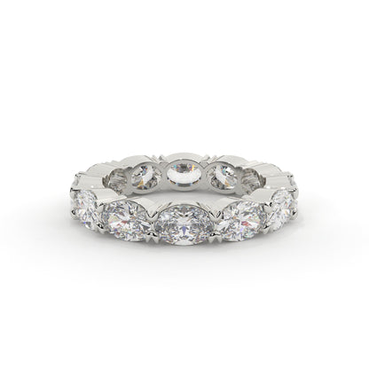 Silver ring with multiple diamonds on a white background