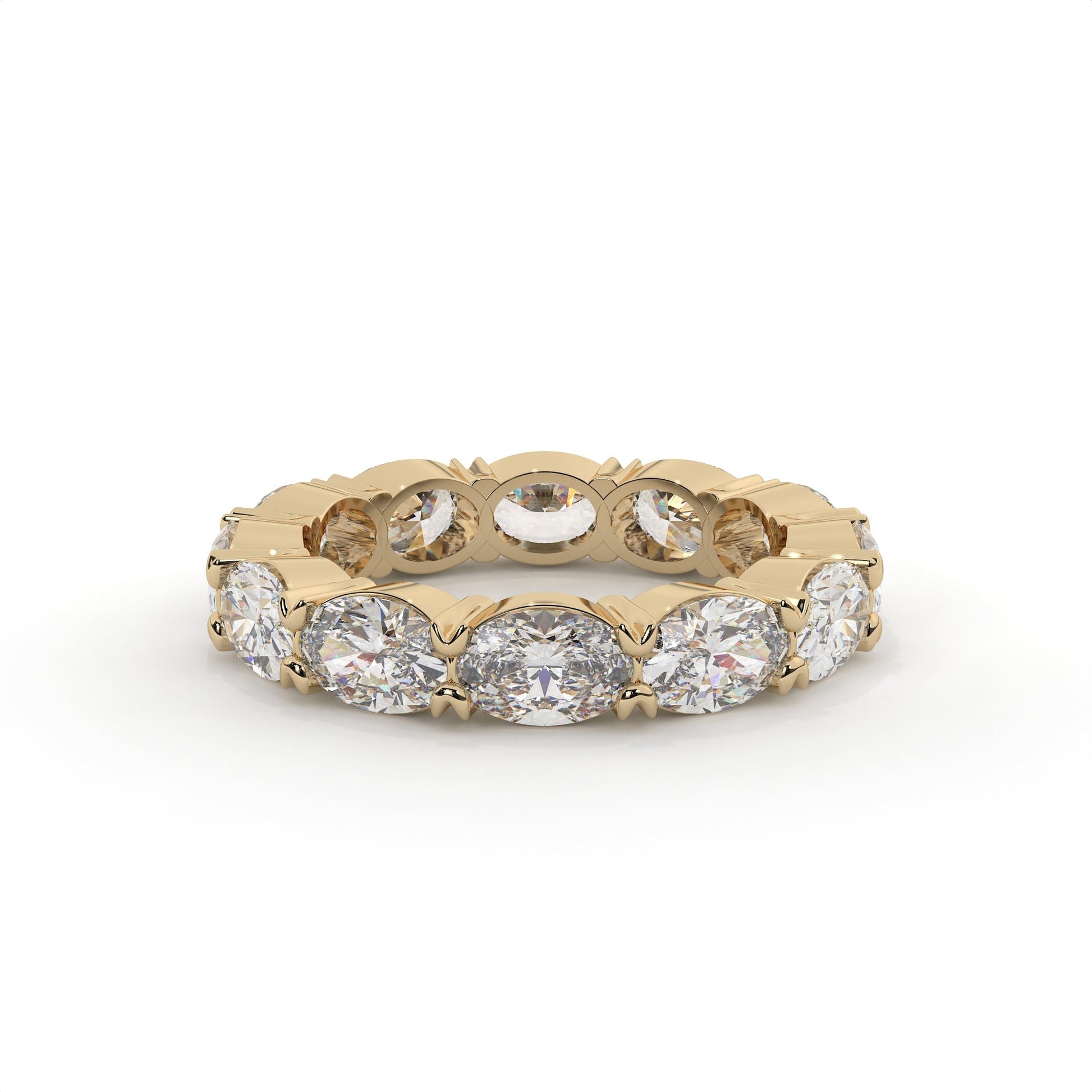 Gold ring with embedded diamonds on a white background