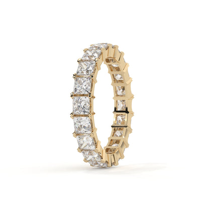 Gold ring with diamond stones on a white background