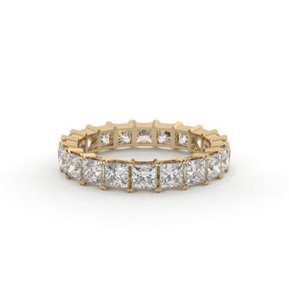 Gold ring with diamond stones on a white background