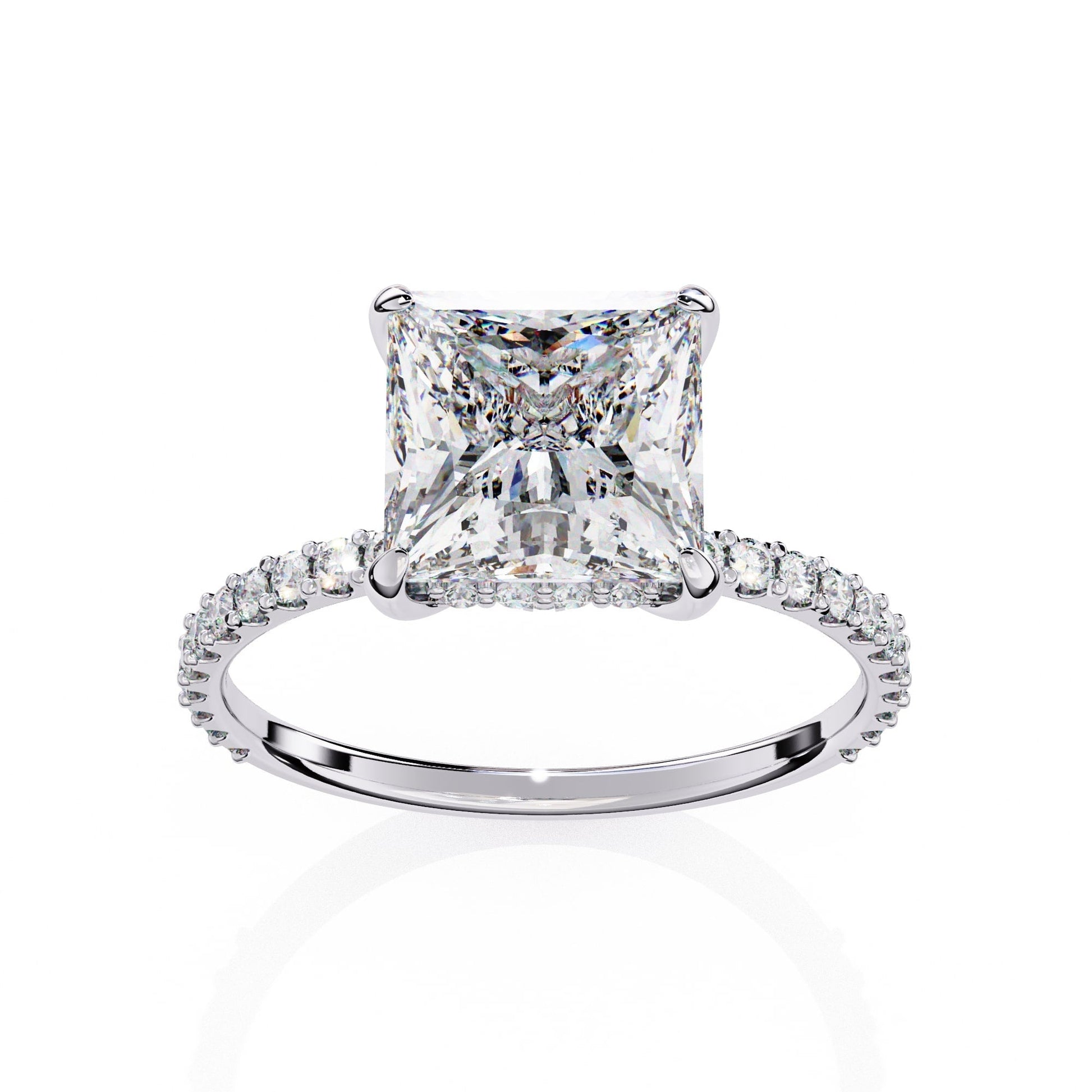 Diamond ring with a prominent princess-cut diamond on a white background