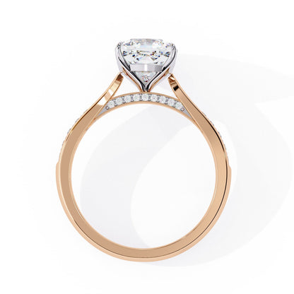 Rose gold ring with a diamond on a white background
