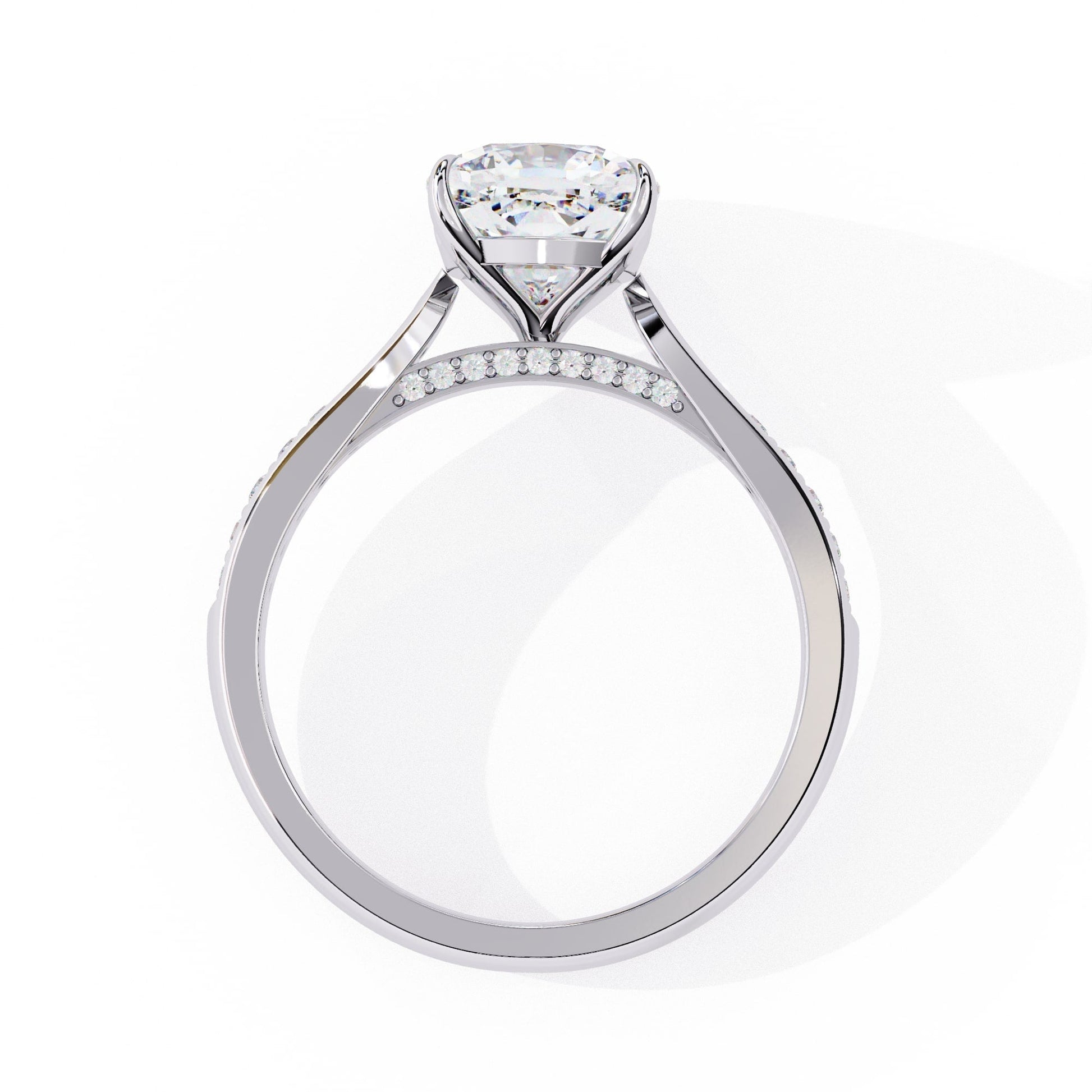 Diamond ring with a heart-shaped center stone on a white background