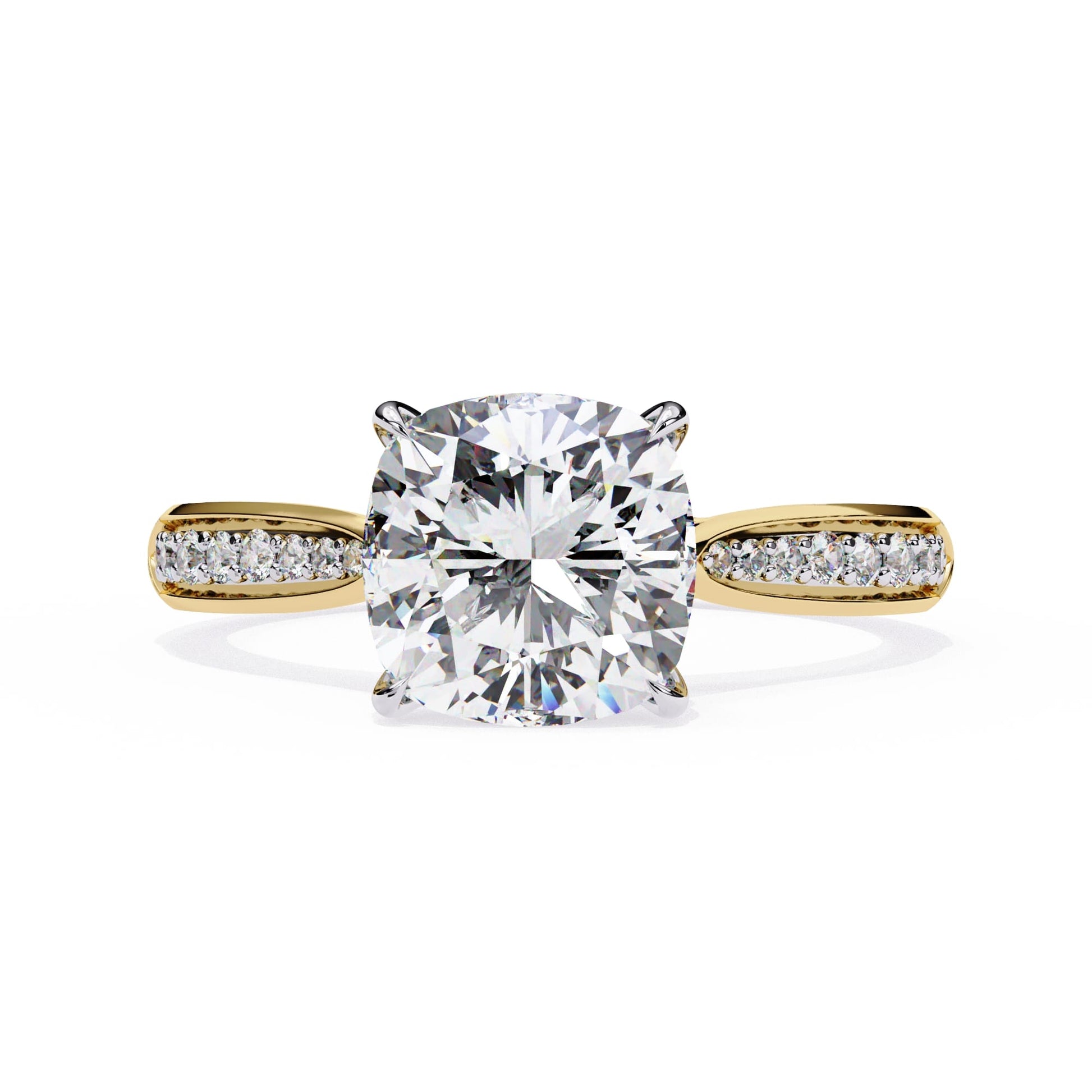 Gold ring with a large diamond and smaller diamonds on the band against a white background