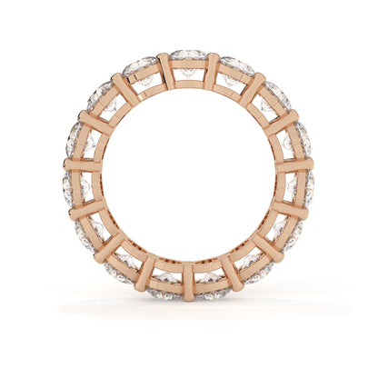 Rose gold ring with diamond accents on a white background